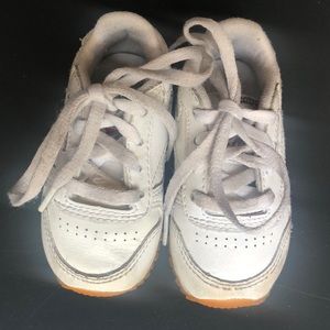 Grown out of. White reebok. Nice cute shoes for infants.